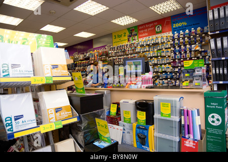 England West Sussex Chichester Ryman's office stationery store interior with two female shop assistants behind counter. Stock Photo