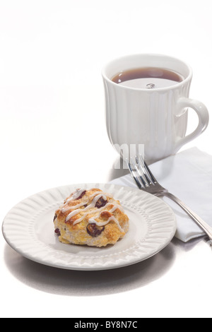 Scone with dried cranberries and a cup of coffee. Stock Photo