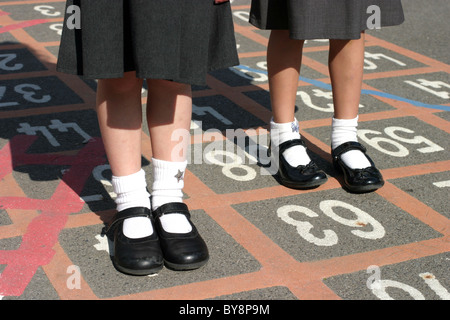 Two School Girls in a School Playground Stock Photo