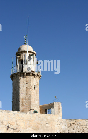 A old Muslim minaret located on the Mount of Olives in the city of Jerusalem, Israel uses megaphones to call Islam worshipers to Stock Photo