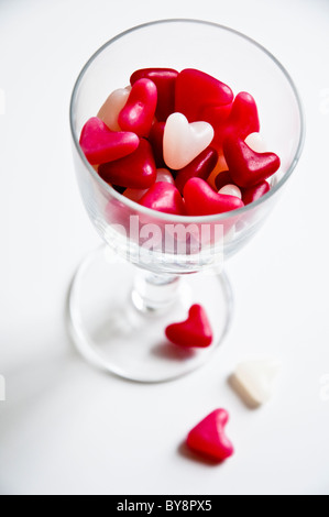 Jelly Bean Hearts in a Wine Glass. ( selective focus ) Stock Photo