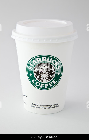 A Starbucks take-away disposable takeout paper coffee cup to go with plastic drink-through lid isolated on plain background. England UK Britain Stock Photo