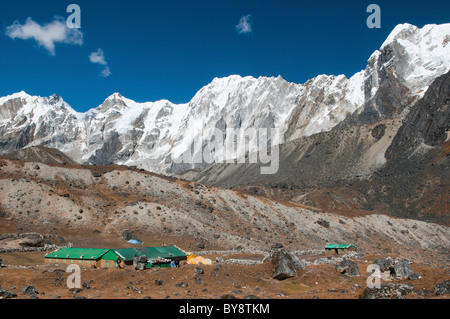 Lobuche Peak and the trekking lodges of Dzongla in the Everest Region of Nepal Stock Photo