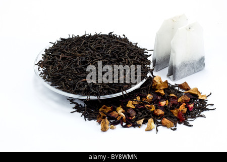 black tea leaves with dried fruit tea on white background Stock Photo