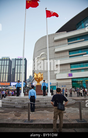 Golden Bauhinia The Bauhinia flower is Hong Kong's emblem. The lowering of the flag display by the police force every day Stock Photo