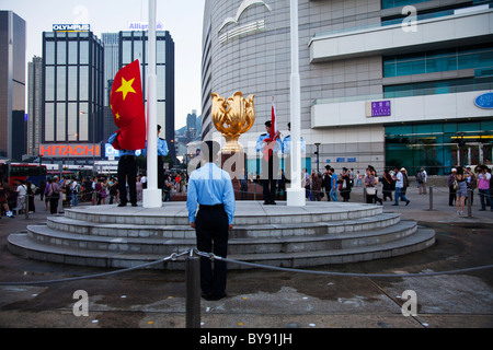 Golden Bauhinia The Bauhinia flower is Hong Kong's emblem. The lowering of the flag display by the police force every day Stock Photo