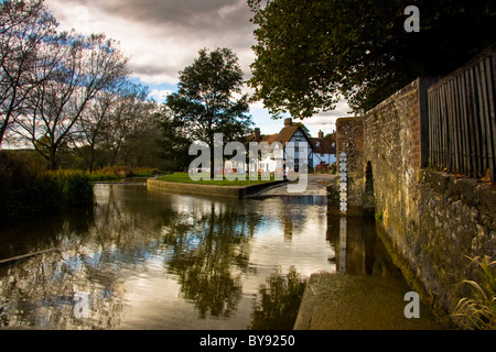 The ford at Eynesford with its old stone bridge reflecting in the water Stock Photo