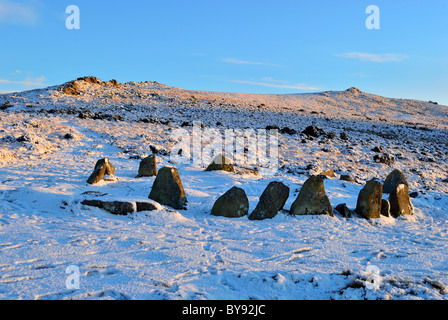 Nine Maidens Stone Circle, Dartmoor in the snow at sunset Stock Photo