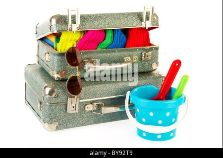 Old vintage carton suitcases with family luggage isolated over white Stock Photo