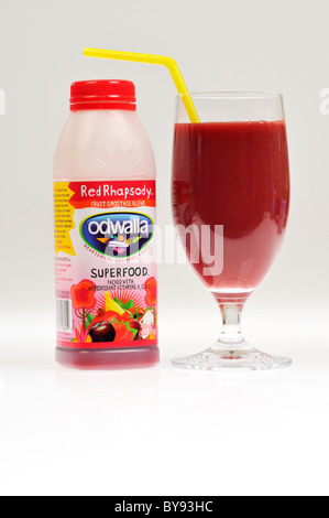 Odwalla red rhapsody fruit smoothie blend drink with glass & straw on white background, cutout. Stock Photo