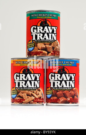 3 cans of Gravy Train dog food stacked on white background, cut out. Stock Photo