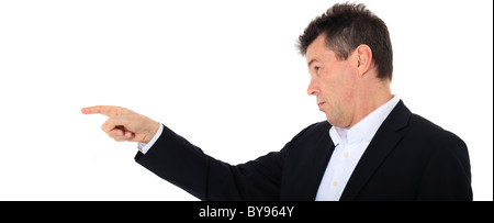 Attractive middle-aged man pointing to the side. All on white background. Stock Photo