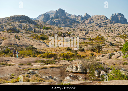 Tourist and park guide walking through the mountains of Andringitra National Park in southern Madagascar. Stock Photo