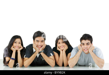 Group Of Friends Looking At Pictures On Digital Camera At Home Stock ...