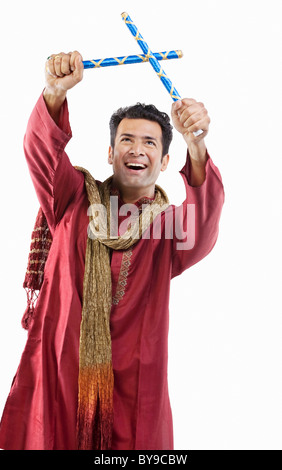 Gujarati man with dandiya sticks Stock Photo - Alamy