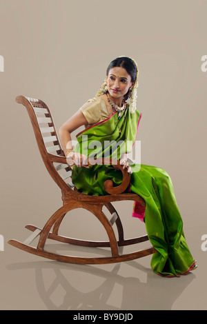 Woman sitting on a chair Stock Photo