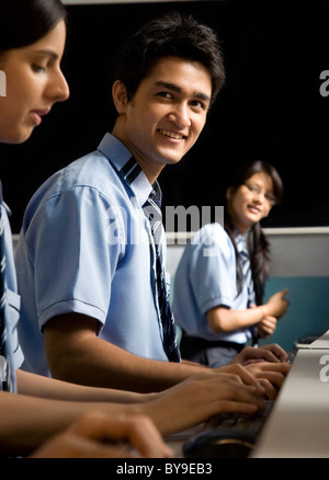 Portrait of a student in a computer lab Stock Photo