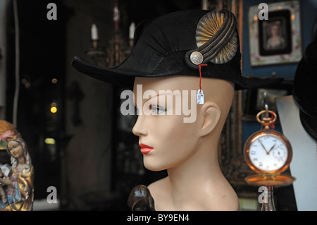 Female shop-window mannequin wearing an old military cap in an antique shop, Lueneburg, Lower Saxony, Germany, Europe Stock Photo