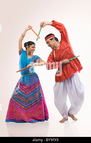 Gujarati couple performing dandiya Stock Photo