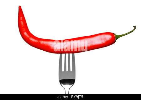 Photo of a red chilli pepper on a fork isolated on a white background, part of a series. Stock Photo