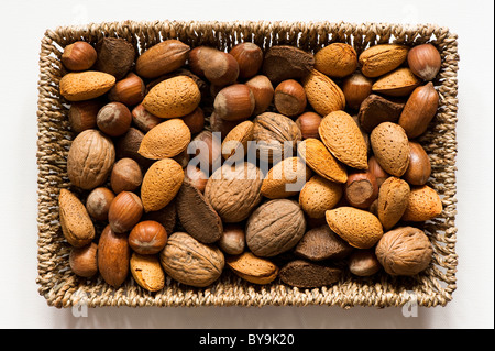 Mixed edible nuts in a basket Stock Photo