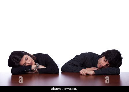 men and woman sleeping at the office desk Stock Photo