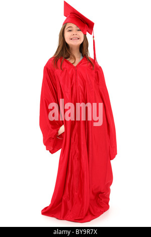 Attractive 7 year old girl in oversized large red graduation cap and gown with diploma over white. Stock Photo