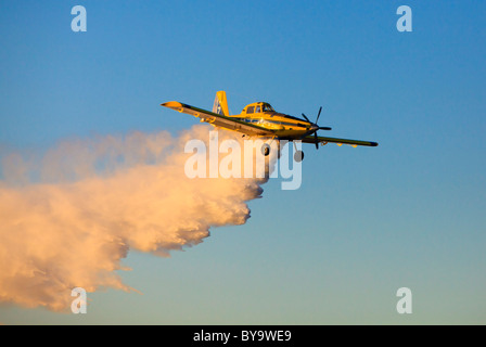 Air Tractor AT-802 firefighting water bomber plane dropping water. Stock Photo