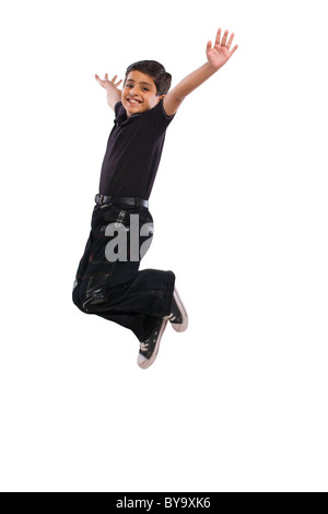 Boy jumping in the air Stock Photo
