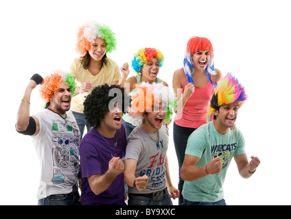 Youngsters with wigs cheering Stock Photo