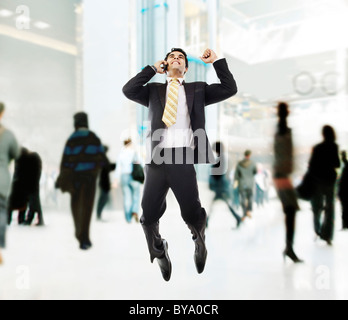 Businessman jumping in the air Stock Photo