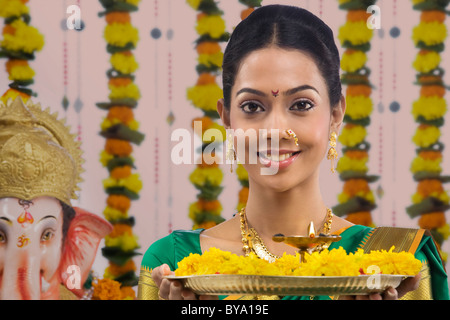 Portrait of a woman performing a pooja Stock Photo