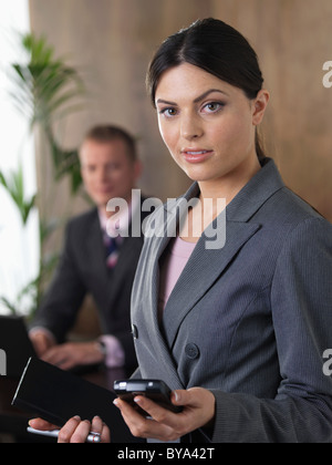 Business man and woman in office Stock Photo