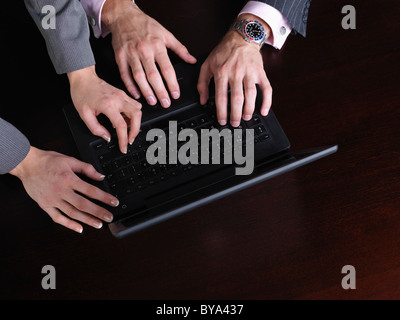 Business man and woman on computer Stock Photo