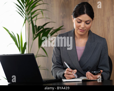 Business woman working in office Stock Photo