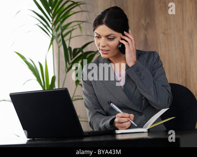 Business woman working in office Stock Photo