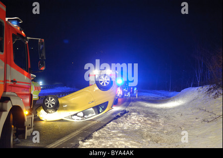 Overturned car after an accident on an icy road, road B 14, Stuttgart, Baden-Wuerttemberg, Germany, Europe Stock Photo
