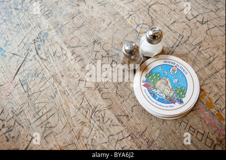 Salt and pepper shakers, beer coasters on a table in Hofbraeuhaus, a beer hall, beer culture, Munich, Bavaria, Germany, Europe Stock Photo