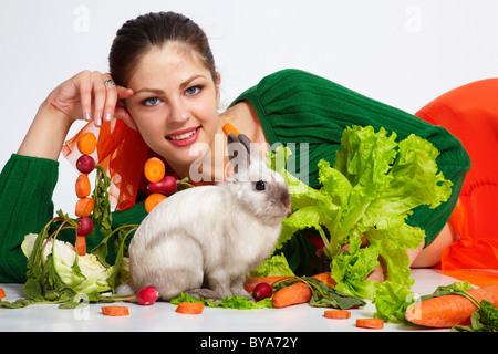 Girl and pygmy rabbit Stock Photo