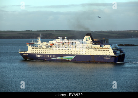 Irish Ferries passenger ship Oscar Wilde departing from Pembroke Dock, as seen from Angle, Pembrokeshire Stock Photo