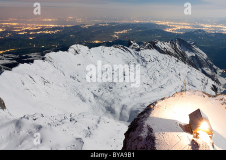 Protective hut on the summit of Saentis Mountain in the light of the full moon, Alpstein, Appenzell Ausserrhoden, Switzerland Stock Photo