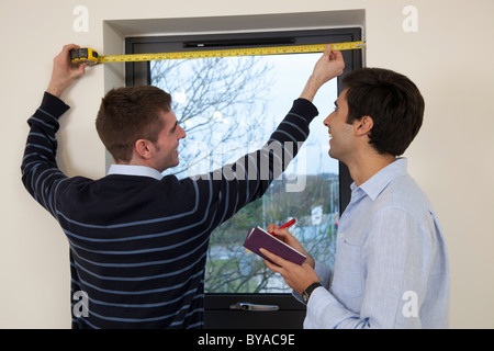 Two developers in their new apartment Stock Photo