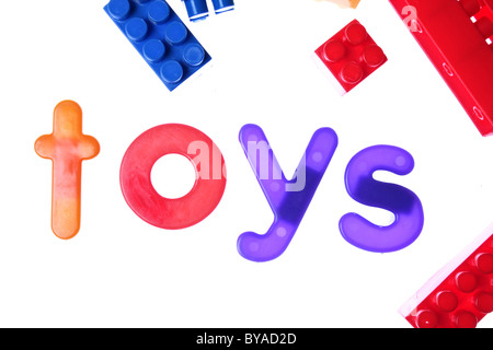 the word toys written on white using children's toy letters Stock Photo