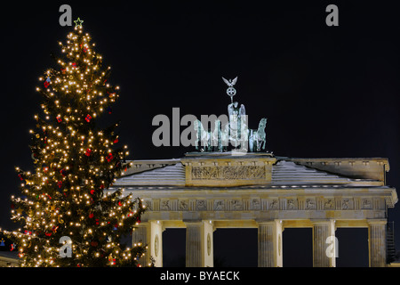Quadriga on Brandenburg Gate with a Christmas tree, Christmas season, Berlin, Germany, Europe Stock Photo