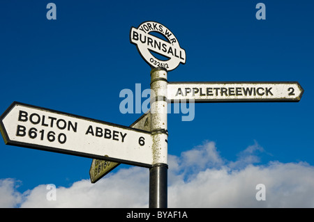 Close up of road sign at Burnsall village showing directions to Bolton Abbey and Appletreewick North Yorkshire Dales England UK GB Great Britain Stock Photo