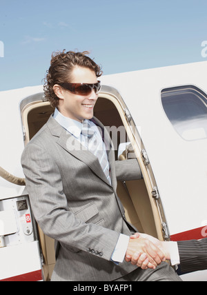 Business executives shaking hands Stock Photo
