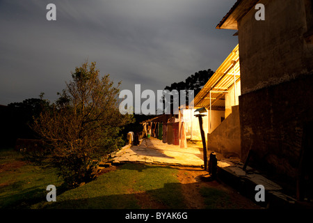 HOUSE IN THE COUNTRY SIDE AT NIGHT Stock Photo