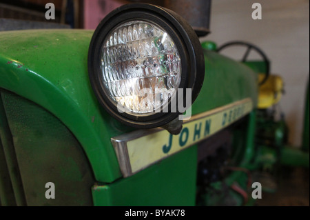 Looking in the eye of a 1960s era John Deere 1010 Tractor Stock Photo