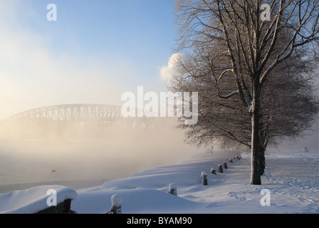 Mist rising from the river Oulu in a cold winter day in Oulu, Finland Stock Photo