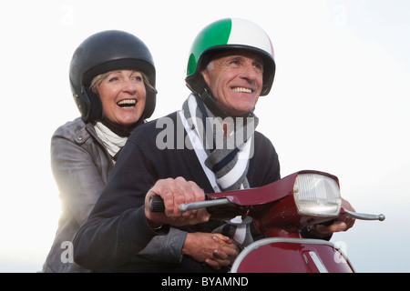 Senior couple on scooter Stock Photo